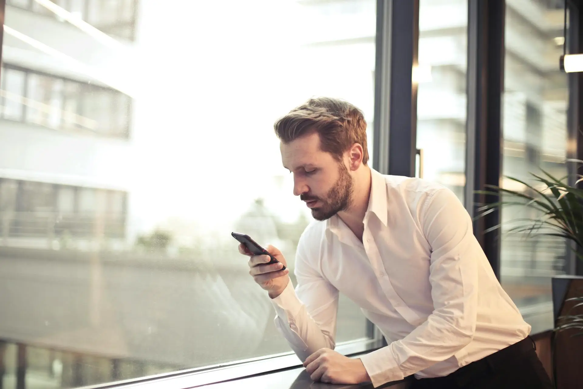 man looking at mobile