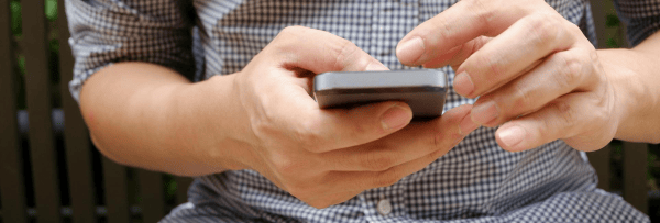 hands and a mobile phone