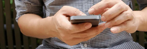 hands and a mobile phone