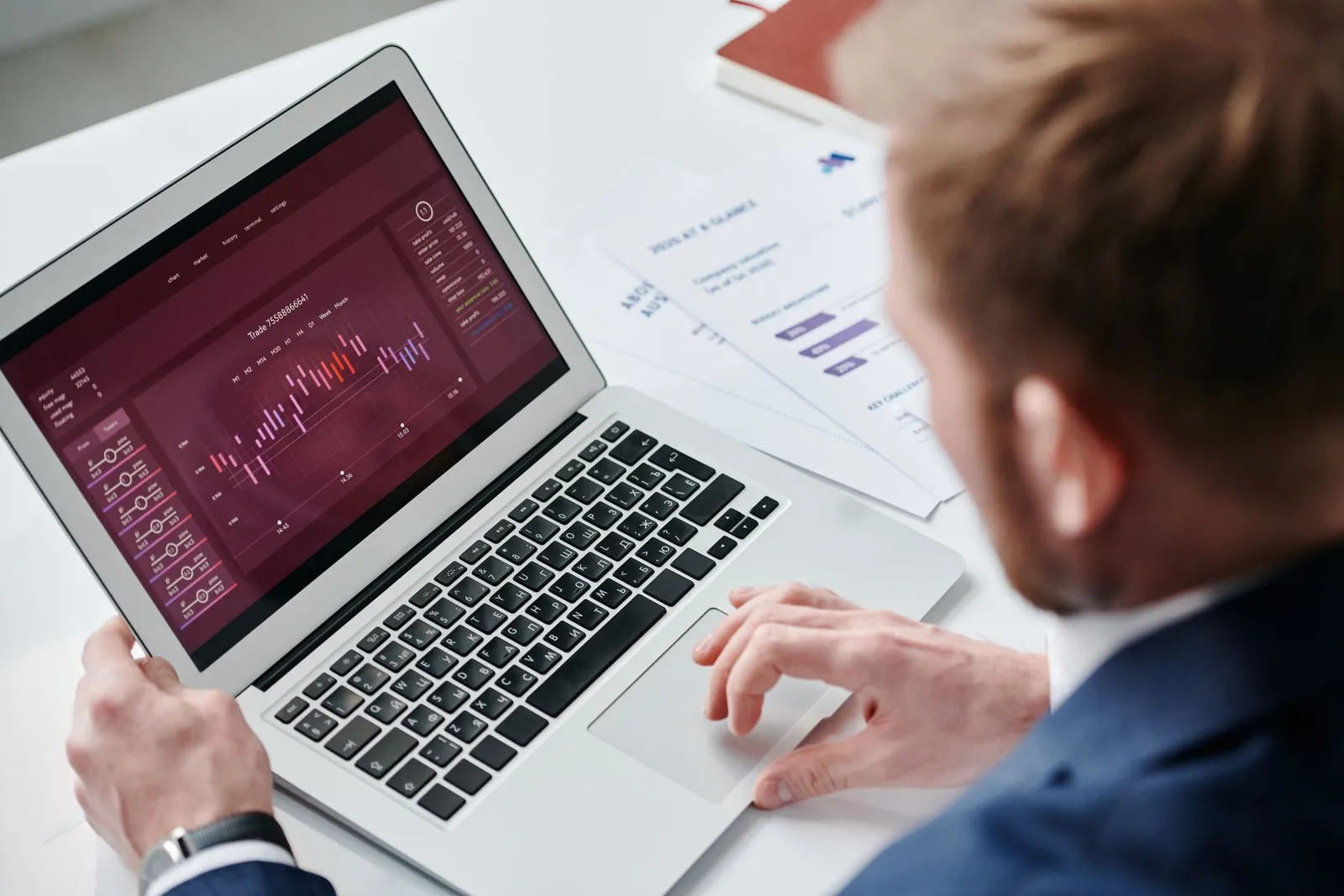 Manager reviewing AI call analytics and transcription reports on a laptop in an office