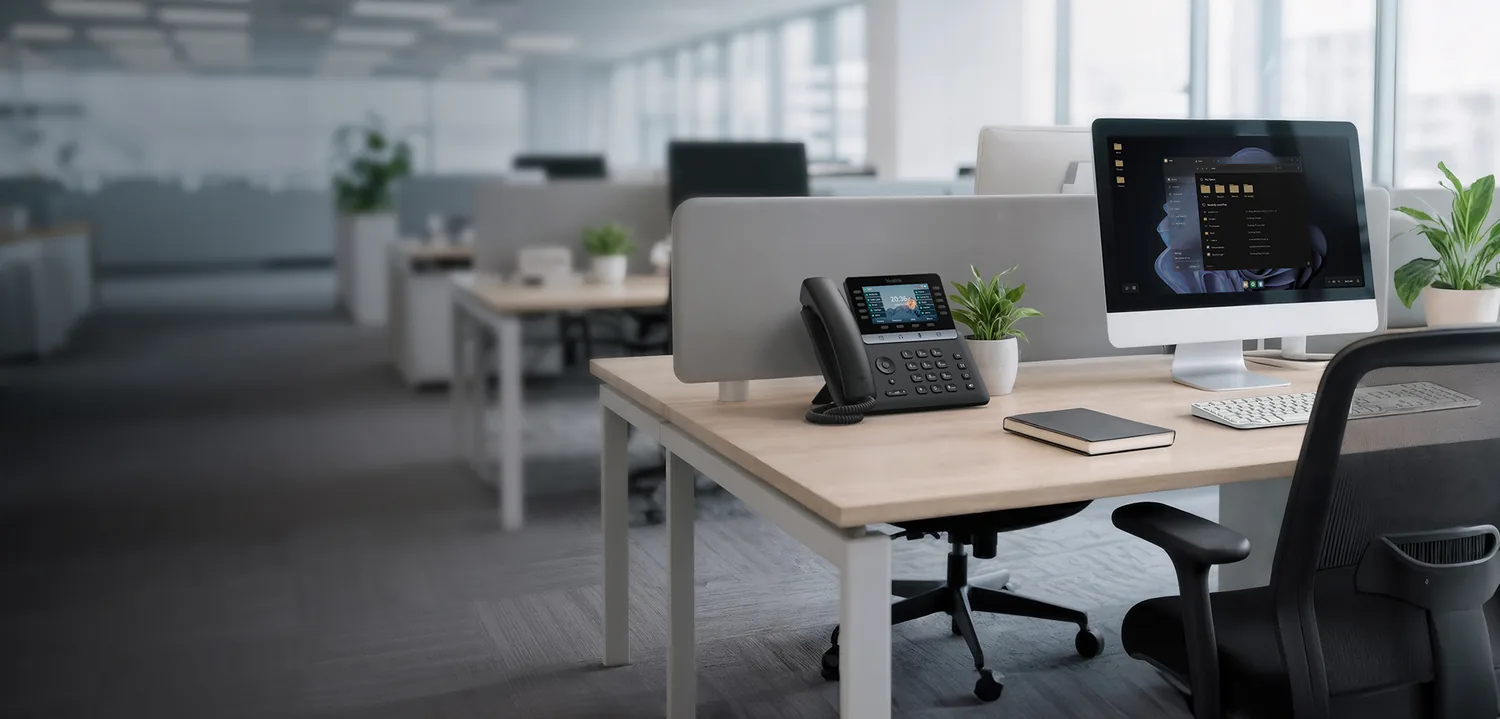 Yealink T74W business desk phone in a modern office — the VoIP handset we recommend for most business phone system users in 2026